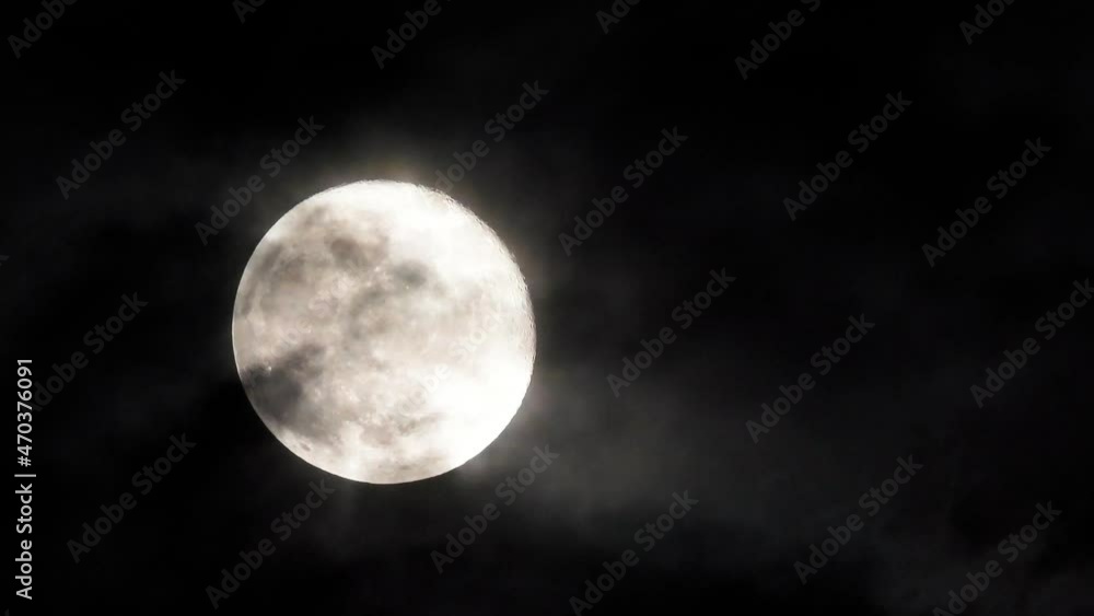 4k 30-sec Full moon moving up the sky against atmospheric winds and gasses 4k 30-sec Full moon moving up the sky against atmospheric winds and gasses