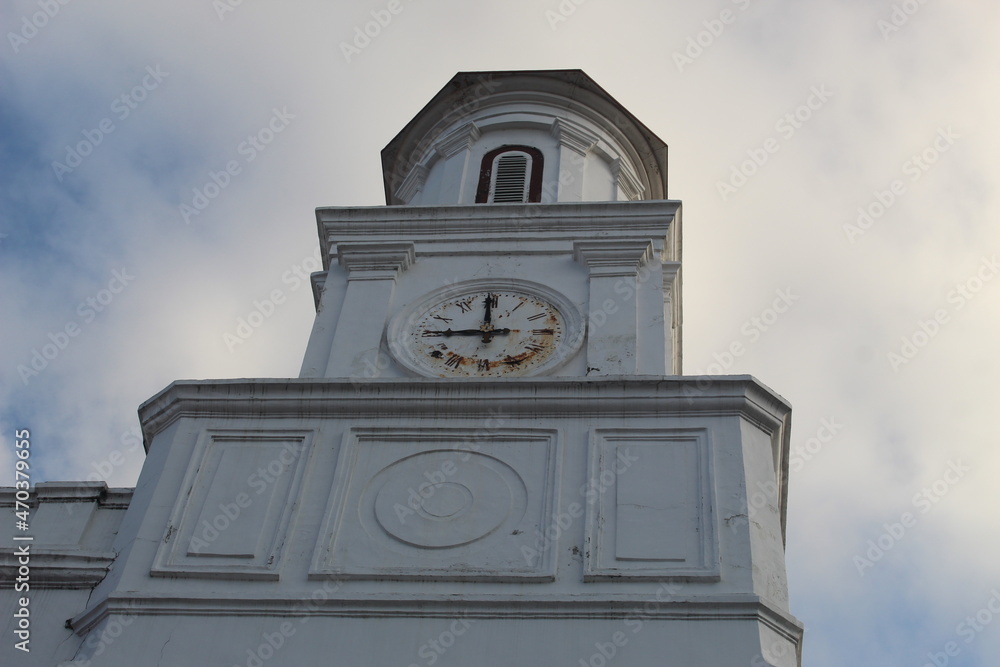 The tall white tower with the clock at the blenduk church, semarang