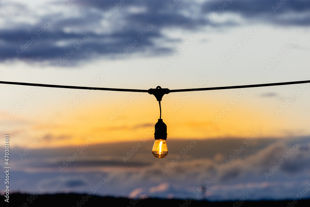 electric lamp on the background of the sunset sky electric lamp on the background of the sunset sky