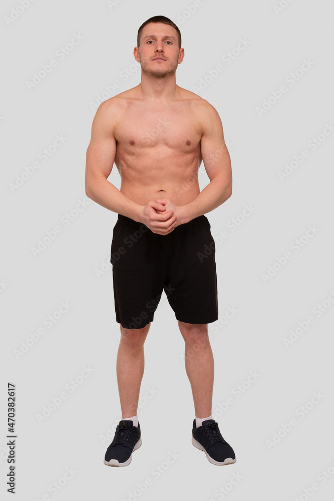 Fototapeta premium Man Standing Showing ABS. Muscle man Posing. Strong Body Concept. Topless Sport man Bodybuilder. Six Pack Spotsman. Full Strength