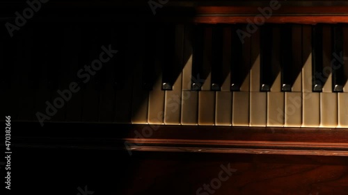 Old piano keys in morning sunlight