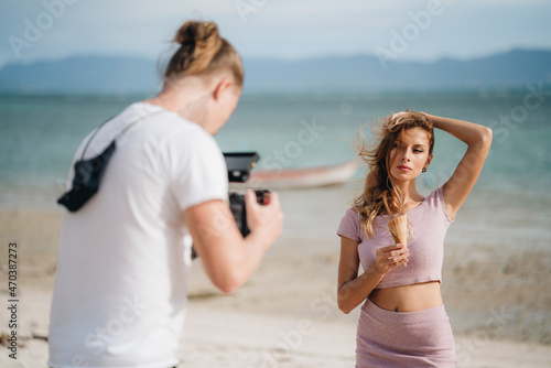 Woman model with ice cream posing at the beach © Natalia
