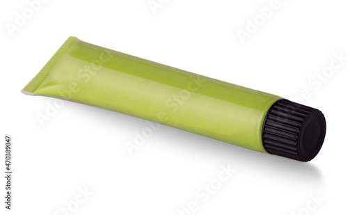 Wasabi sauce in a plastic tube with black lid isolated on white background.