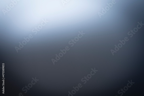 realistic black background wallpaper texture with light flickering on a black surface