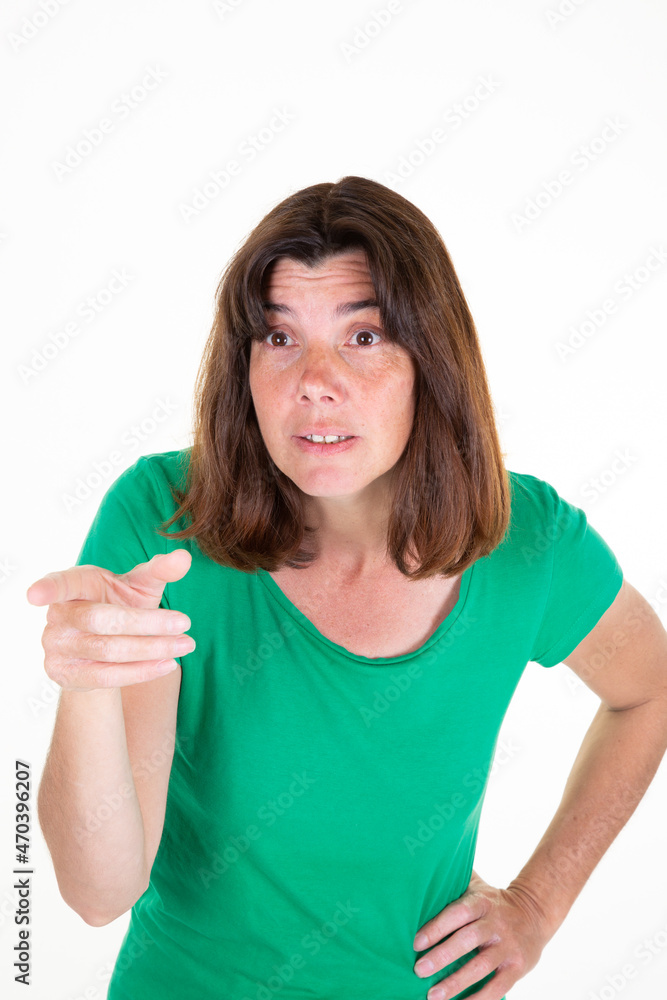angry woman standing with pointing finger on white background angry woman standing with pointing finger on white background
