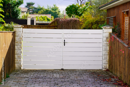 white classical home door aluminum gate slats portal garden entry suburb house