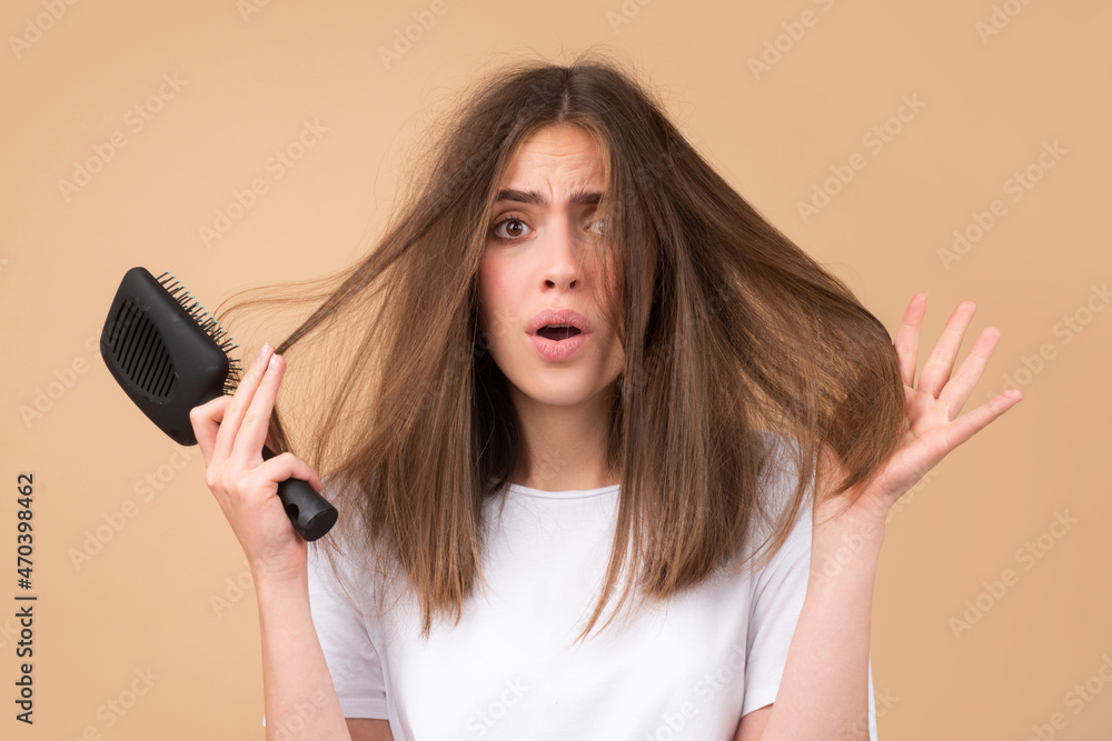 Hair loss problem treatment. Portrait of woman with a comb and problem hair. Hair loss problem treatment. Portrait of woman with a comb and problem hair.