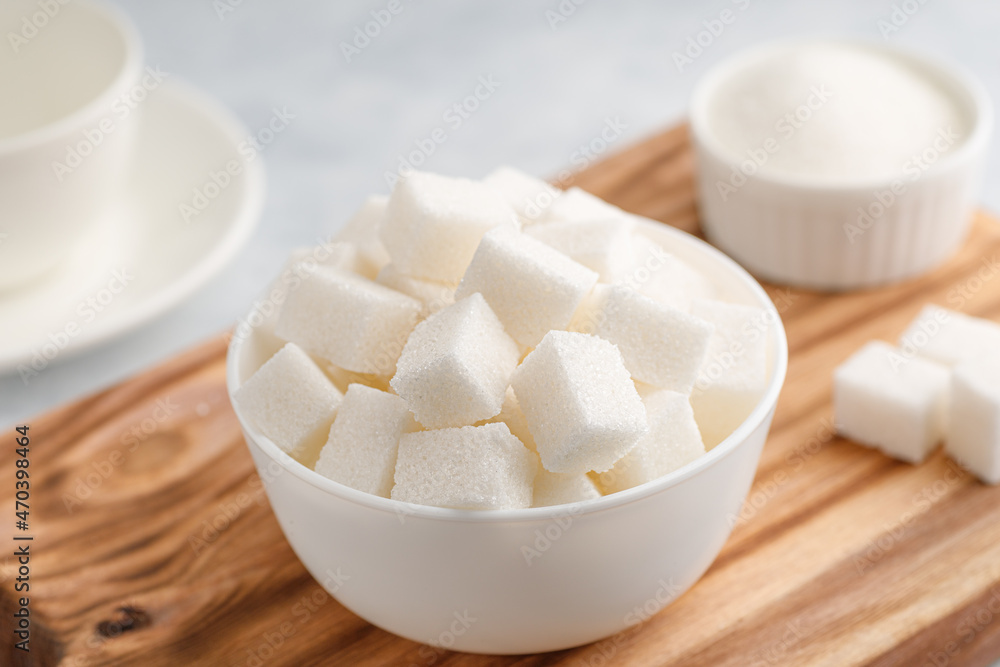 White granulated sugar and sugar cubes White granulated sugar and sugar cubes