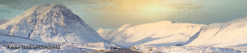 Fényképezés Buachaille Etive Mor mountain and empty road covered in snow during winter