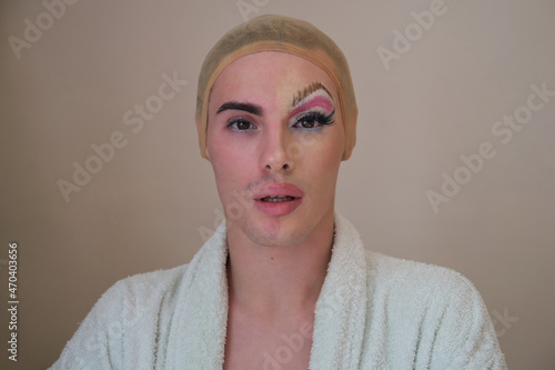 Half man half woman make up person. Drag queen person with and without make up. photo