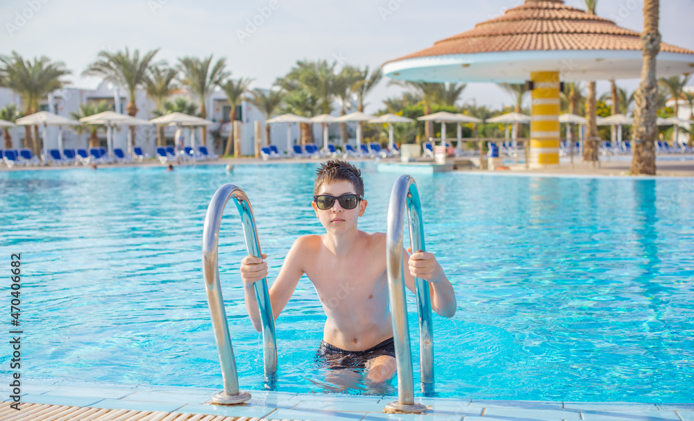 Boy rest in vacation. Teenage boy in swimming pool, Children lifestyle. Enjoy the life