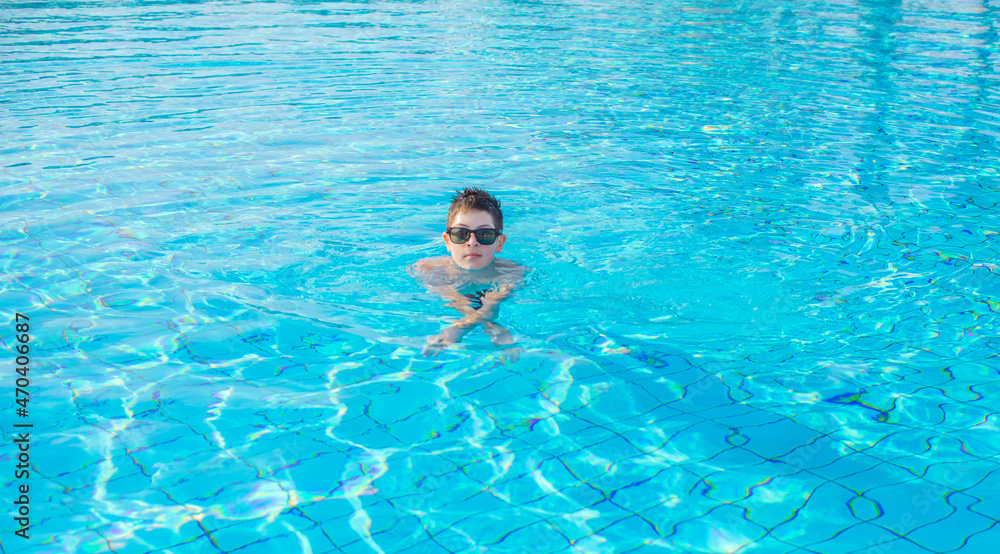 Boy rest in vacation. Teenage boy in swimming pool, Children lifestyle. Enjoy the life