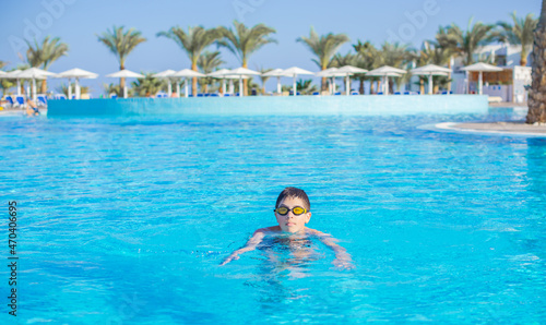 Boy rest in vacation. Teenage boy in swimming pool, Children lifestyle. Enjoy the life © T.Den_Team