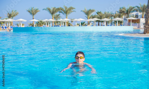 Boy rest in vacation. Teenage boy in swimming pool, Children lifestyle. Enjoy the life