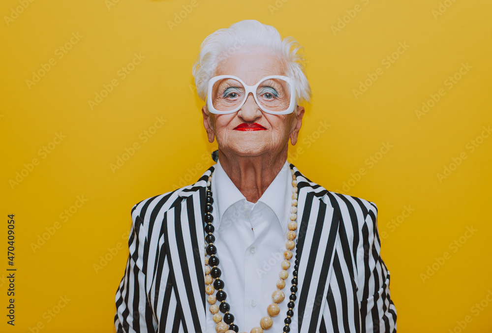 © oneinchpunch - Funny grandmother portraits. Senior old woman dressing elegant for a special event. granny fashion model on colored backgrounds