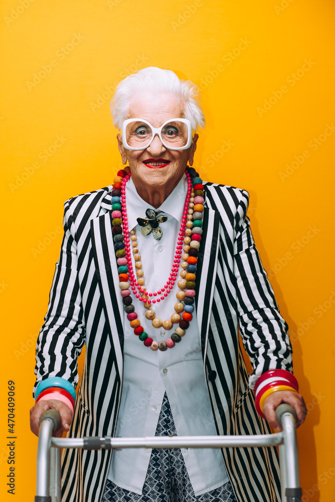 Leinwandbild Motiv - oneinchpunch : Funny grandmother portraits. Senior old woman dressing elegant for a special event. granny fashion model on colored backgrounds