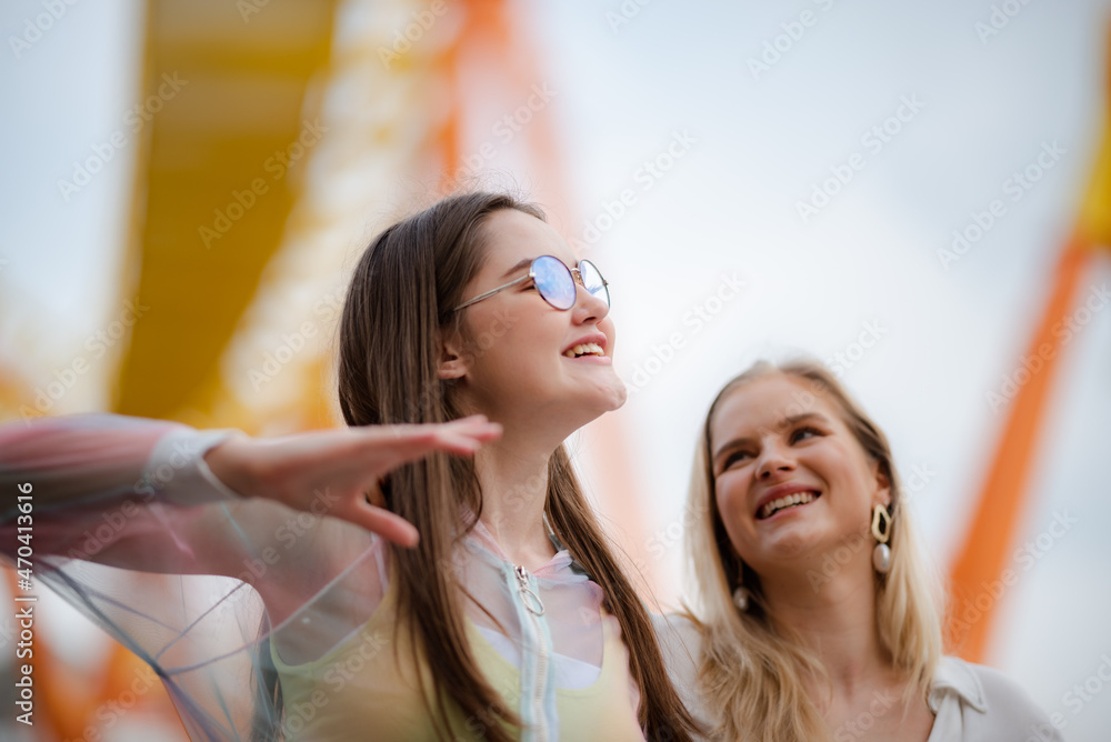 young woman having fun and happy smiling together at amusement theme park outdoor young woman having fun and happy smiling together at amusement theme park outdoor