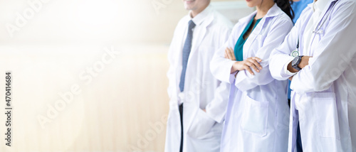 Group of asian doctors looking at camera. Mixed race professional medical doctor and nurse meeting. photo