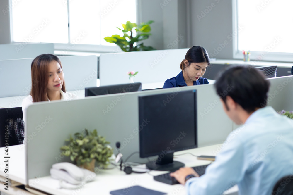 young asian business woman working on desk with desktop computer in modern home office. young asian business woman working on desk with desktop computer in modern home office.
