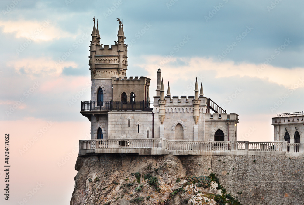 Beautiful gothic castle Swallow's Nest on a 40-meter cliff of Cape Ai-Todor above the Black Sea in the village of Gaspra, Yalta region of Crimea. The main attraction of the Crimean peninsula