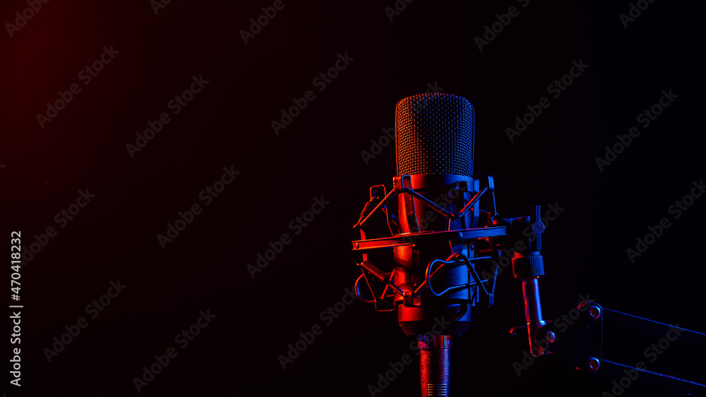 Professional microphone in pink smoke on a black background. Professional microphone in pink smoke on a black background.