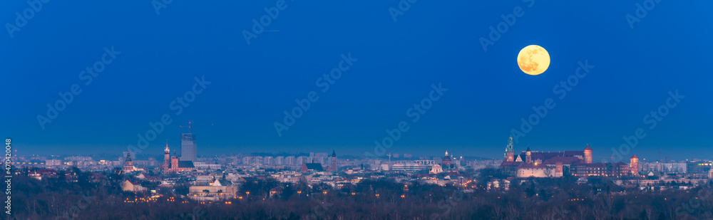 Moonrise over Wawel castle in Krakow, Poland