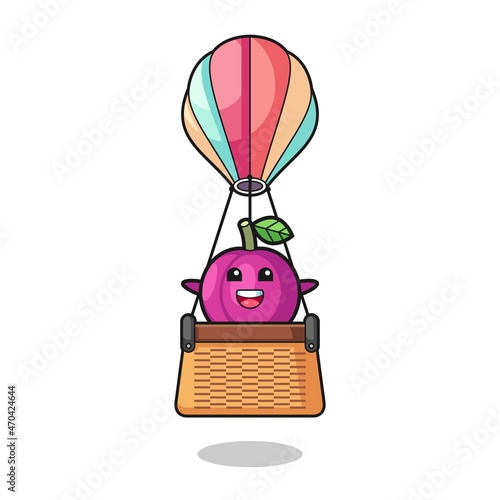 Fotografia, Obraz plum fruit mascot riding a hot air balloon