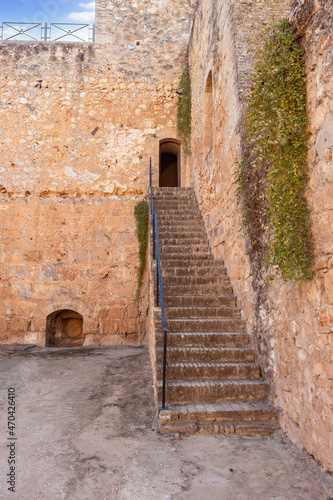 Niebla, Spain - November 18, 2021: Stairs to go up to the towers or turrets in  defensive walls of Niebla castle, in Huelva, Andalucia, Spain © Alfredo