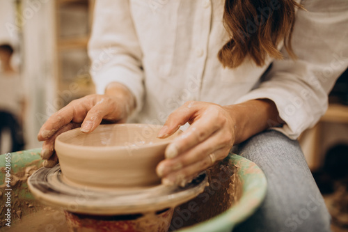 Female potter at a pottery class