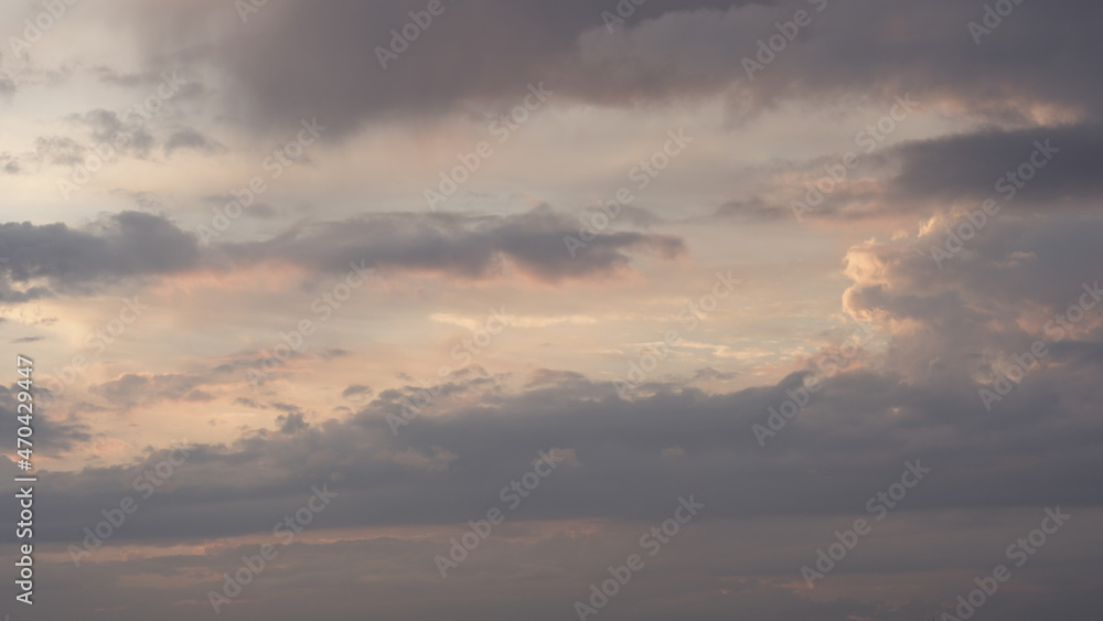 Sunset or sunrise cloudscape with clouds backlit