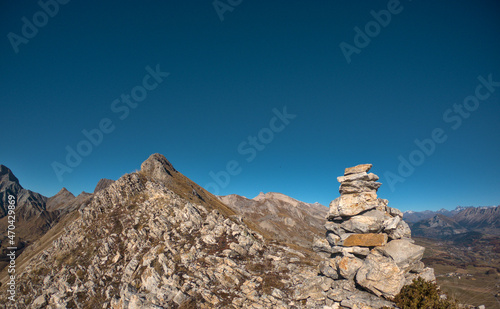 Landscape, including a ridge and a cair (stones pyramide), shot during a hike on the mountain call 