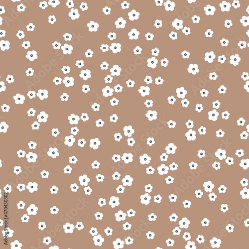 Seamless vintage pattern. Small white flowers on a light brown background. vector texture. fashionable print for textiles and wallpaper.