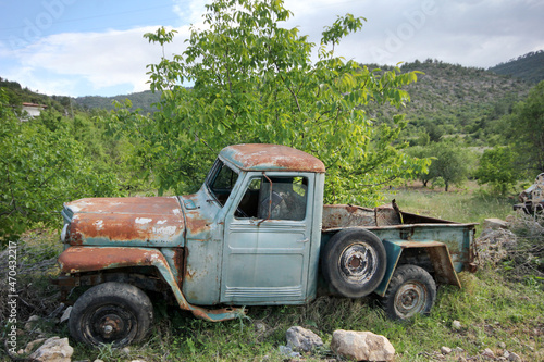 old abandoned pickup truck in the meadow