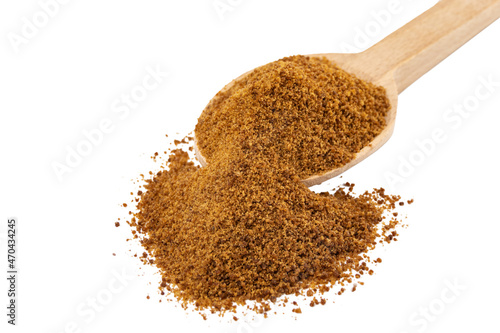 coconut sugar on wooden spoon isolated on white background. Spice and food ingredients.
