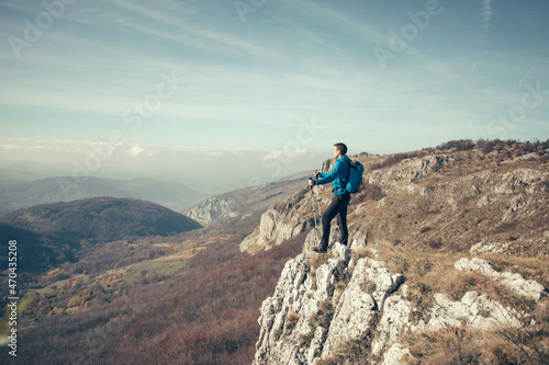 Hiker man at mountain viewpoint © yossarian6