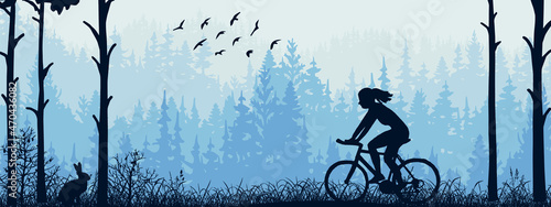 Horizontal banner. Silhouette of girl riding bike on meadow in forrest. Silhouette of biker, trees, grass. Magical misty landscape, fog. Blue illustration. Bookmark.