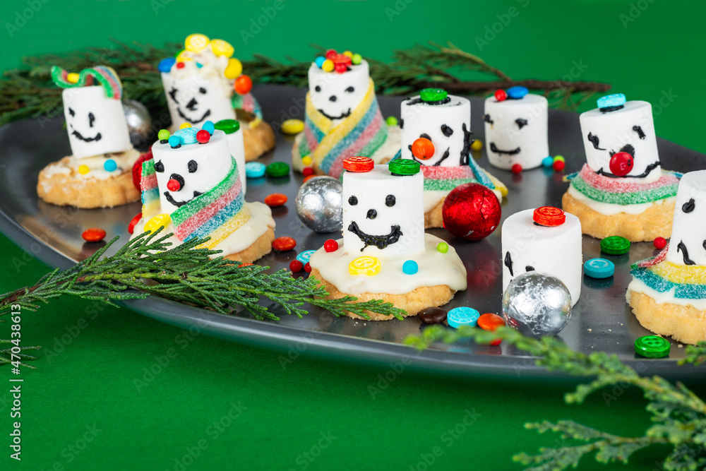 Melting marshmallow snowmen preparation process. Christmas, New Year kid's sweet