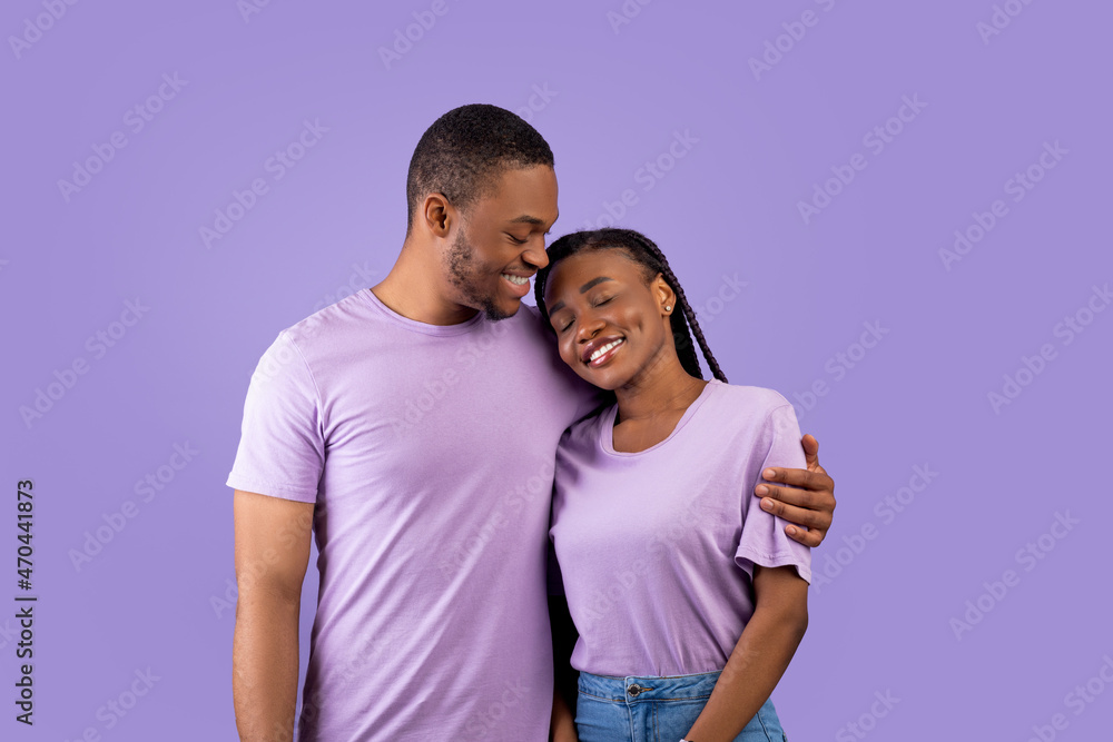 African American man hugging his woman at studio African American man hugging his woman at studio