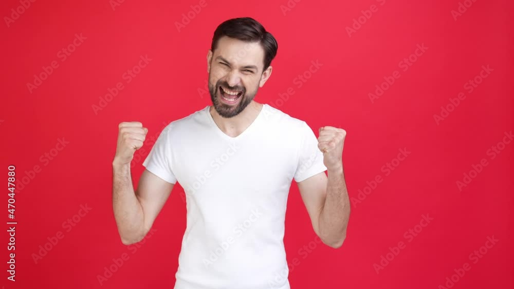 Ecstatic man present ads raise hands up point red color background isolated Ecstatic man present ads raise hands up point red color background isolated
