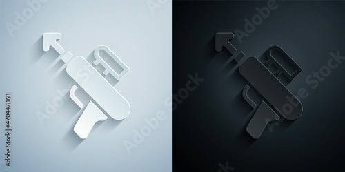 Paper cut Fishing harpoon icon isolated on grey and black background. Fishery manufacturers for catching fish under water. Diving underwater equipment. Paper art style. Vector