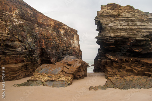 Eroded rock walls on the beach of the cathedrals.