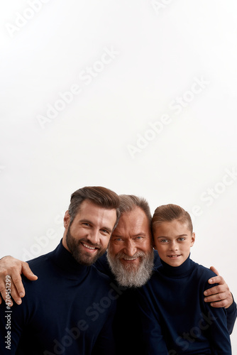 Vertical portrait of smiling grandfather hug offsprings