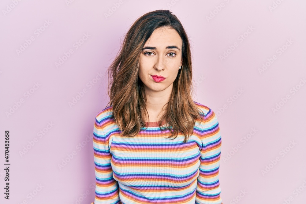Young hispanic girl wearing casual clothes looking sleepy and tired, exhausted for fatigue and hangover, lazy eyes in the morning. Young hispanic girl wearing casual clothes looking sleepy and tired, exhausted for fatigue and hangover, lazy eyes in the morning.