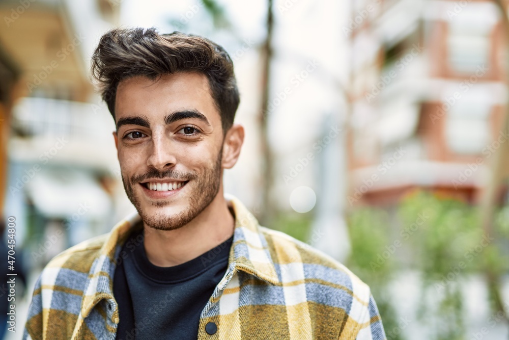 Handsome hispanic man smiling happy and confident at the city Handsome hispanic man smiling happy and confident at the city