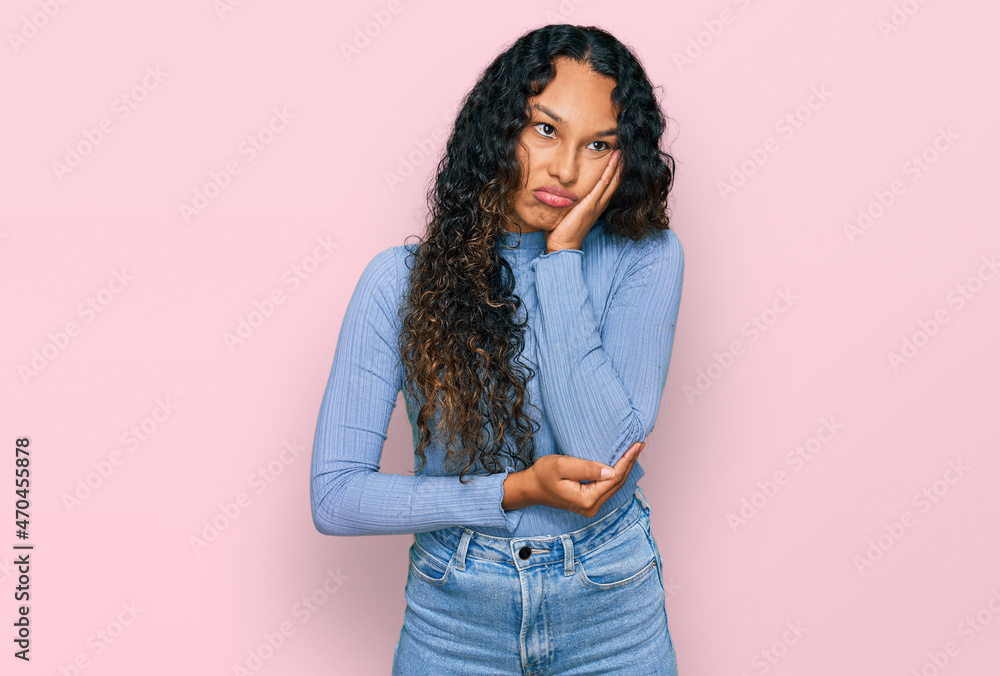 Young hispanic woman with curly hair wearing casual clothes thinking looking tired and bored with depression problems with crossed arms. Young hispanic woman with curly hair wearing casual clothes thinking looking tired and bored with depression problems with crossed arms.