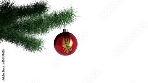 New Year ball with the flag of Montenegro on a Christmas tree branch isolated on white background. Christmas and New Year concept.