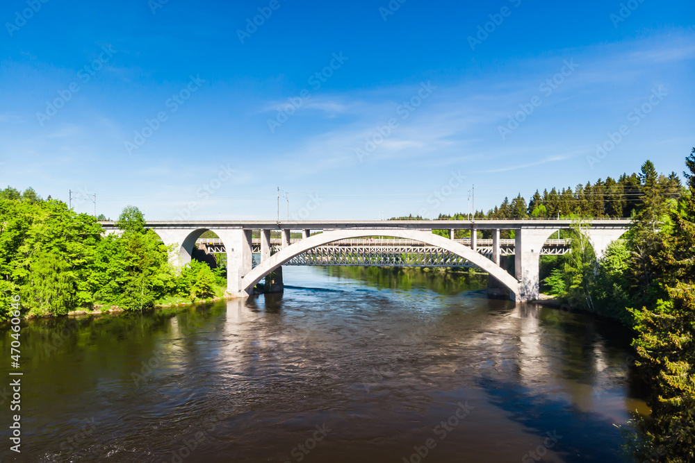 Summer aerial view of bridge and Kymijoki river waters in Finland, Kymenlaakso, Kouvola, Koria Summer aerial view of bridge and Kymijoki river waters in Finland, Kymenlaakso, Kouvola, Koria