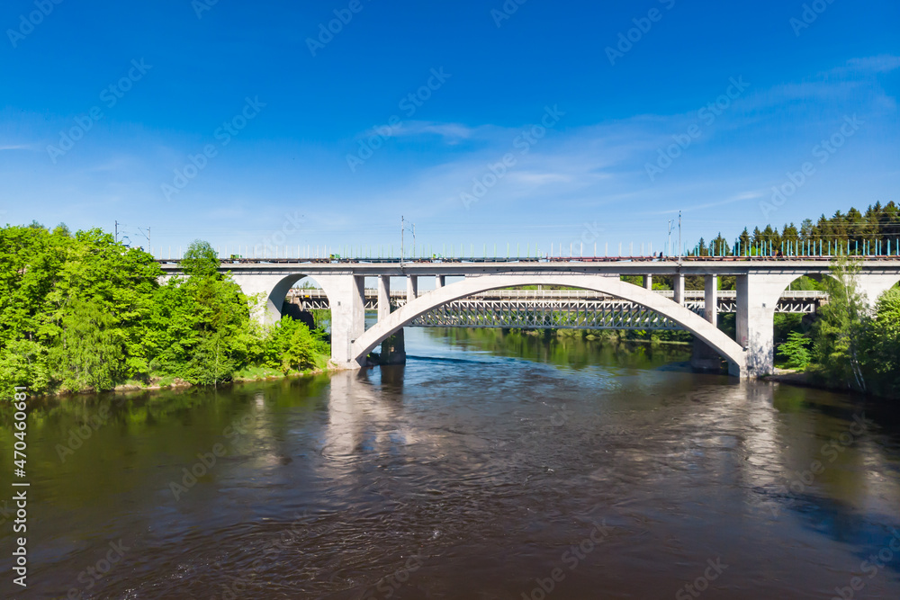 Summer aerial view of bridge and Kymijoki river waters in Finland, Kymenlaakso, Kouvola, Koria Summer aerial view of bridge and Kymijoki river waters in Finland, Kymenlaakso, Kouvola, Koria