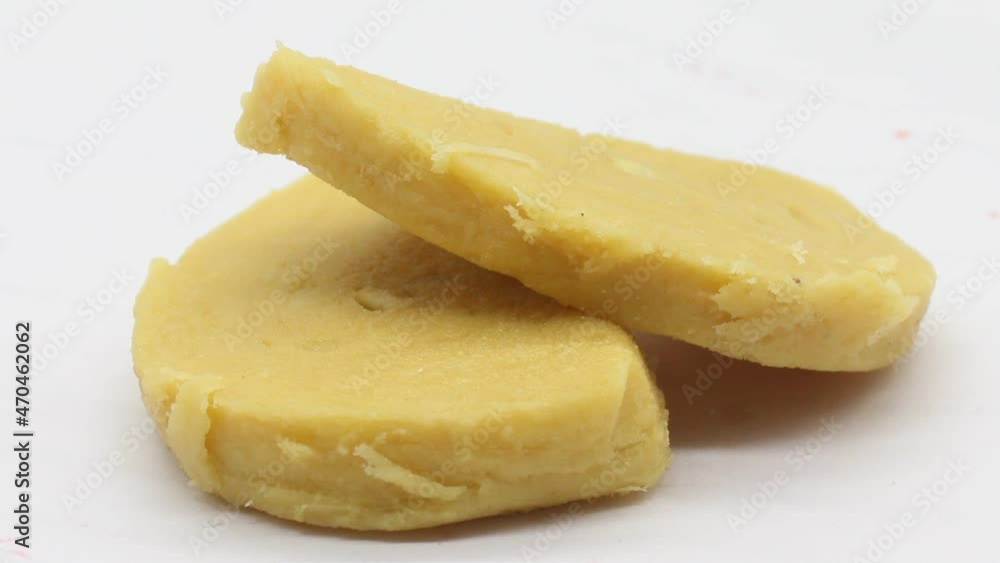 Gram flour sweets on white background with selective focus Gram flour sweets on white background with selective focus