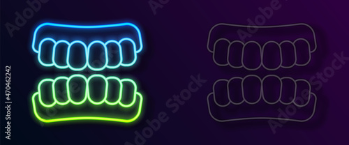 Glowing neon line Dentures model icon isolated on black background. Teeth of the upper jaw. Dental concept. Vector